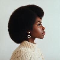 Model showcases natural hairstyle in profile against simple background during a studio shoot photo