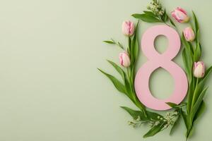 Decorative arrangement of pink tulips alongside a number eight on a light turquoise background photo