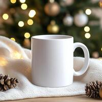 White mug resting on cozy blanket with pine cone and golden ornament illuminated by soft lights photo