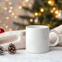 White mug resting on cozy blanket with pine cone and golden ornament illuminated by soft lights photo