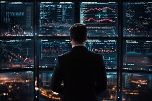 Business professional analyzes data in a modern office setting at night photo