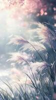 Soft sunlight illuminates delicate grass swaying gently in the breeze during early morning photo