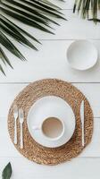 Elegant breakfast table setting with white dishware and natural elements photo