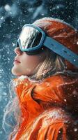 Snowy mountain adventure with skier in bright orange jacket and goggles during winter photo