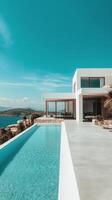 Luxury villa with infinity pool overlooking ocean and clear skies in serene landscape photo