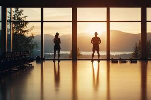 Two individuals exercising in a gym with scenic mountain views in the background photo