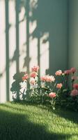 Soft pink flowers bloom beside a white wooden fence on a sunny day in a tranquil garden setting photo