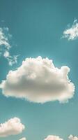 Soft white cloud drifting in a clear blue sky during daytime photo