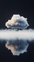 Cloud hovering above calm water with mist in serene atmosphere photo