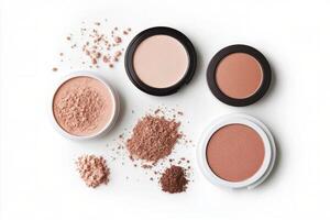 Various shades of loose powder cosmetics arranged on a clean white background photo