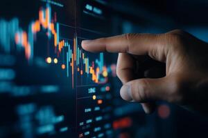 Financial analysis using digital charts and touch interface in a dark environment photo