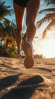 Running on sandy beach during sunset with palm trees in the background photo