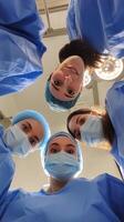Medical team collaborates during a surgical procedure in a modern operating room photo