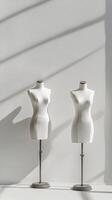 Mannequins displayed in a well lit studio showcasing fashion design concepts photo
