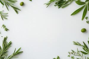 Fresh green leaves and olives arranged on a light background for culinary presentation photo