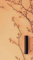Delicate cherry blossom branches against a soft orange backdrop creating a serene atmosphere photo