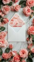 Delicate arrangement of pink roses surrounding an open envelope with petal accents photo