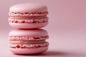 Delightful pink macarons surrounded by sparkling droplets on a pastel background photo