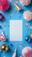 Colorful party decorations arranged on a bright blue surface with a blank space for message photo