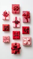 Colorful pink and red gift boxes arranged in a creative pattern for a special celebration photo