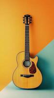 Acoustic guitar set against a bright orange and blue background for a bold contrast photo