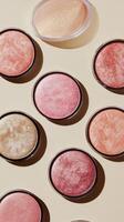 Varied blush colors displayed in a circular arrangement on a neutral backdrop photo