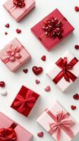 Colorful pink and red gift boxes arranged in a creative pattern for a special celebration photo