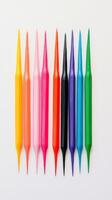 Colorful arrangement of artistic pencils on a plain background showcasing creativity and craft photo