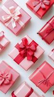 Colorful pink and red gift boxes arranged in a creative pattern for a special celebration photo