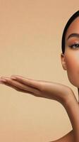 Model showcasing natural beauty with soft makeup and glowing skin in neutral background photo