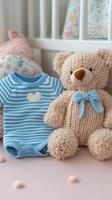 Soft blue knitted outfit with plush toys arranged on a light background photo