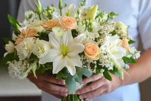 Beautiful floral bouquet of roses and hydrangeas held by a person outdoors in soft daylight photo