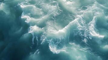 Waves crashing on sandy beach during sunny day photo