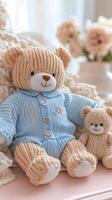 Soft blue knitted outfit with plush toys arranged on a light background photo