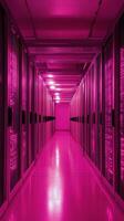 Bright pink illuminated server room with rows of servers and glowing lights photo