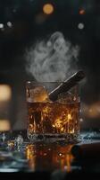 Warm drink with ice and smoke on a rustic table with cigar and gold accents photo
