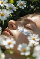 Relaxing skincare routine in a flower garden during soft daylight photo