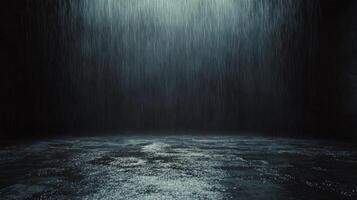Dark space with heavy rain creating a moody atmosphere and reflective surface photo