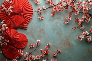 Colorful paper fans and cherry blossoms create a vibrant decorative display on a blue background photo
