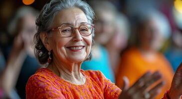 Joyful elderly woman applauding at a lively gathering during a bright daytime event photo