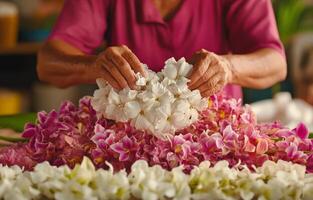 Woman arranging beautiful flowers in a market during midday photo