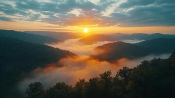 Majestic sunrise over rolling hills and misty valleys in a tranquil landscape photo