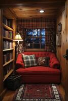 Cozy cabin corner with warm lighting and snow outside during winter evening photo