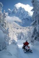 Snowmobiling through scenic mountains on a clear winter day photo