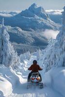 Snowmobiling through scenic mountains on a clear winter day photo