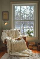 Cozy cabin corner with warm lighting and snow outside during winter evening photo