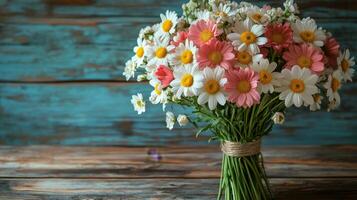 Beautiful floral arrangement displayed on a rustic table in a bright indoor setting photo