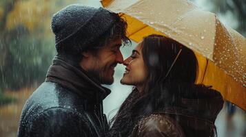 Couple sharing a romantic moment under an umbrella in the rain photo