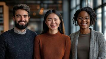Group of smiling individuals posing together in a casual environment with warm lighting photo