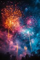 Fireworks illuminate the night sky over a harbor with sailing ships at dusk photo